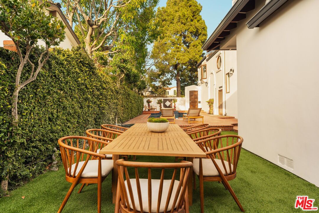 222 14th Street Santa Monica, CA 90402 - Photo 38 of 42 a view of a patio with table and chairs with wooden floor and fence