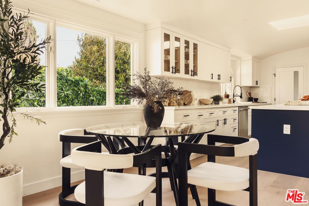 222 14th Street Santa Monica, CA 90402 - Photo 6 of 42 a view of a dining room with furniture and chandelier