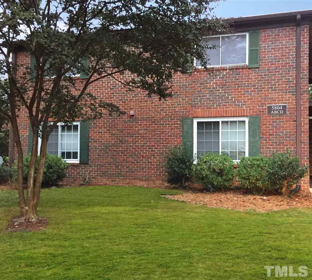 5804 Falls Of Neuse Road, Unit A Raleigh, NC 27609 - Photo 1 of 9 a front view of a house with a garden