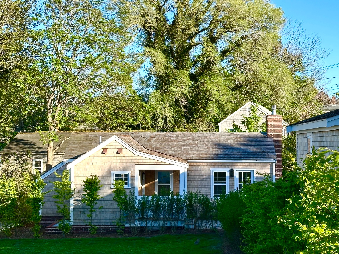 10 Silver Street Nantucket, MA 02554 - Photo 8 of 48 a front view of a house with a yard