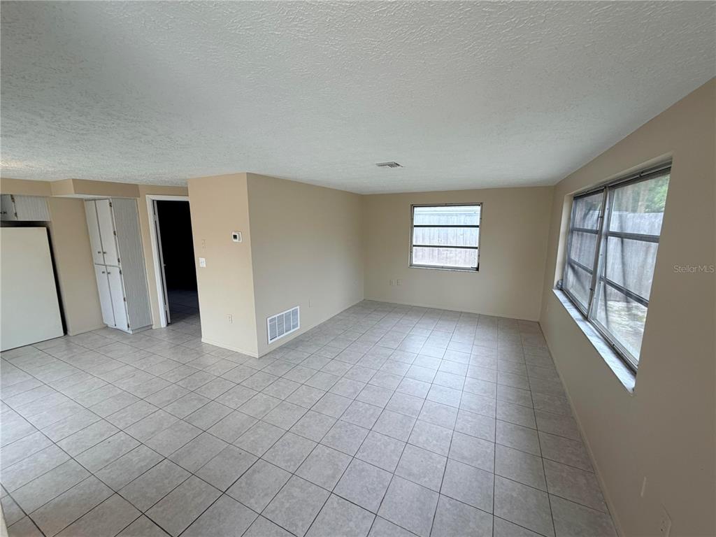 6330 Pennsylvania Avenue New Port Richey, FL 34653 - Photo 4 of 17 an empty room with windows