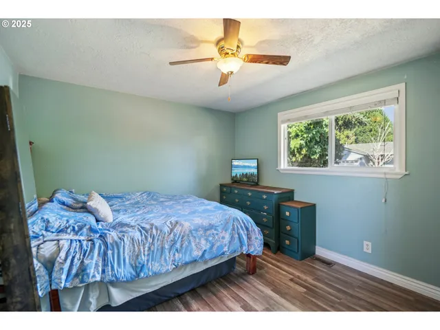 a bedroom with a bed and a table