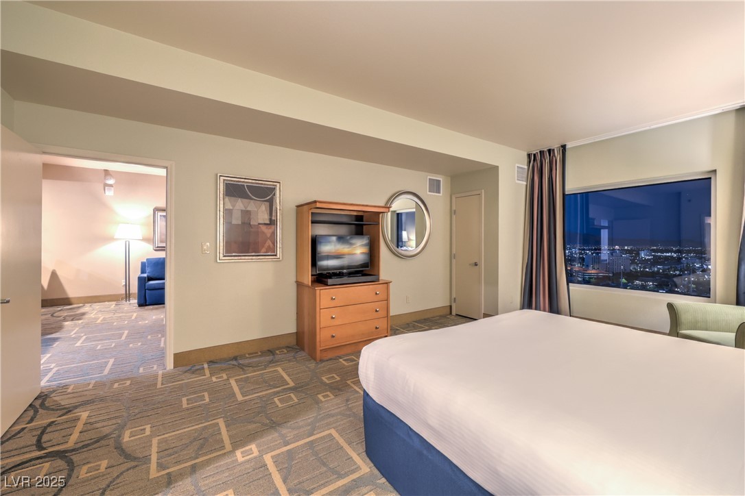 211 East Flamingo Road, Unit 1508 Las Vegas, NV 89169 - Photo 16 of 40 Bedroom with baseboards and dark carpet