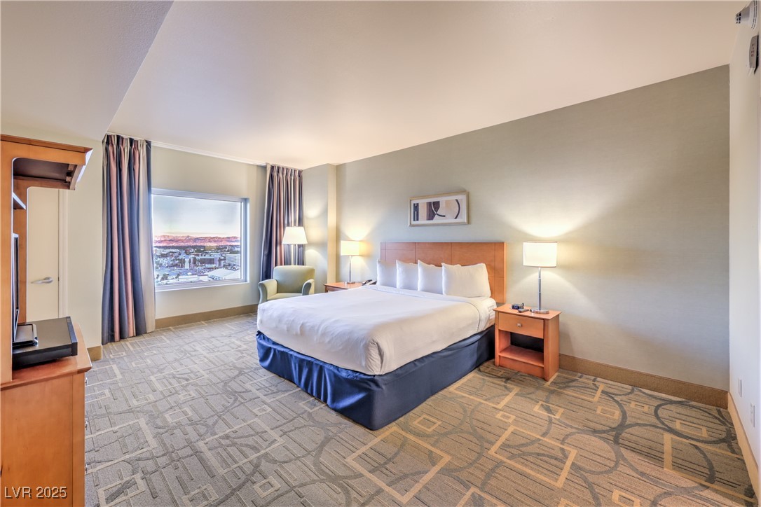 211 East Flamingo Road, Unit 1508 Las Vegas, NV 89169 - Photo 17 of 40 Carpeted bedroom with baseboards