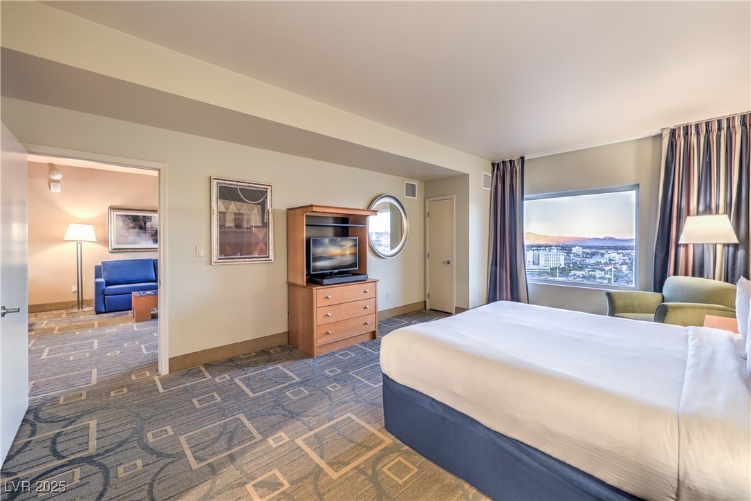 211 East Flamingo Road, Unit 1508 Las Vegas, NV 89169 - Photo 19 of 40 Bedroom with baseboards and dark carpet