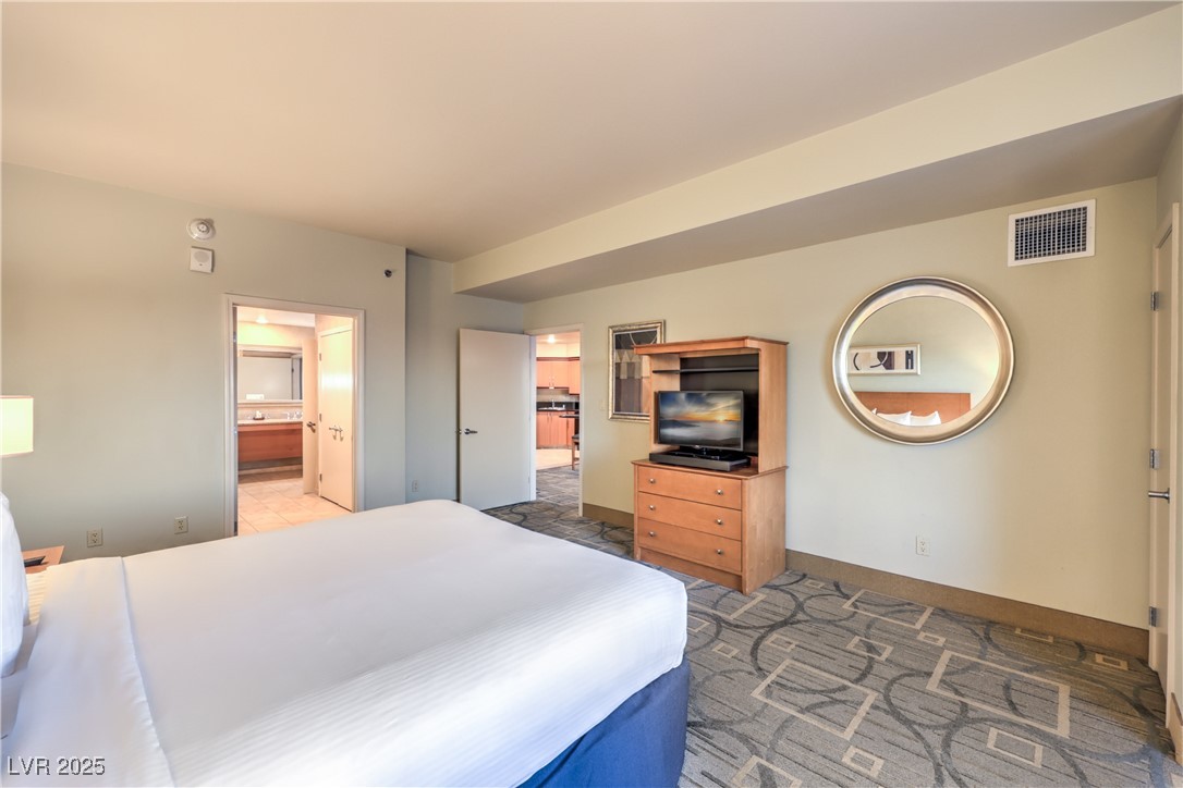 211 East Flamingo Road, Unit 1508 Las Vegas, NV 89169 - Photo 21 of 40 Bedroom featuring baseboards