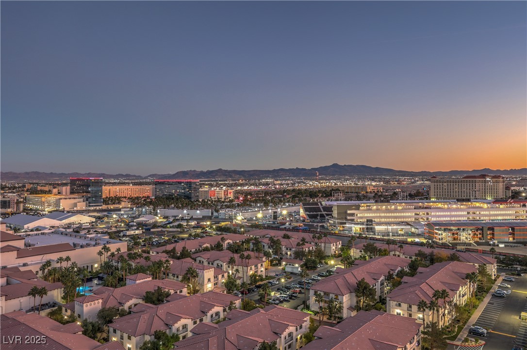 211 East Flamingo Road, Unit 1508 Las Vegas, NV 89169 - Photo 32 of 40 Aerial view at dusk of a city view, a residential view, and a mountain view