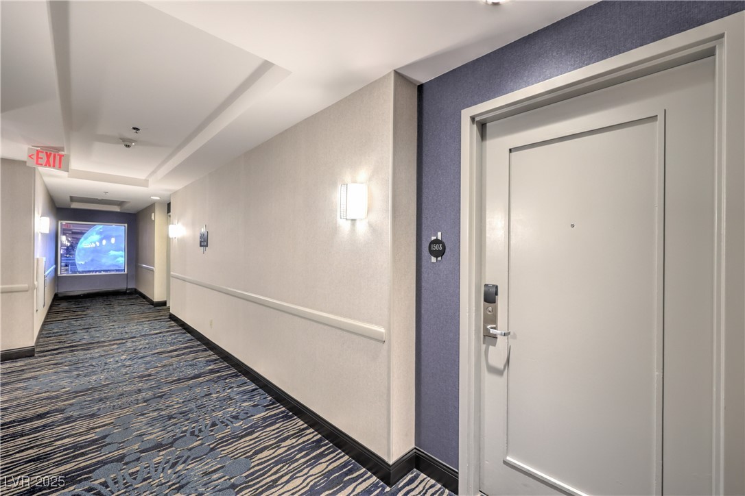 211 East Flamingo Road, Unit 1508 Las Vegas, NV 89169 - Photo 39 of 40 Hall with dark carpet and a tray ceiling