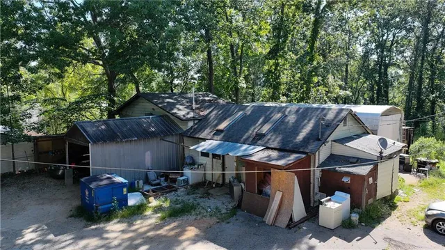 a view of backyard with furniture and trees