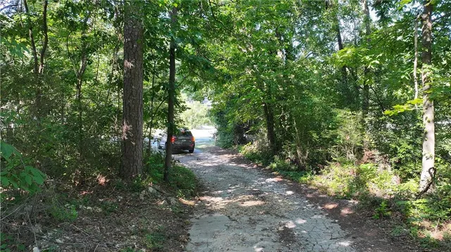 a backyard of a house with oven and tree