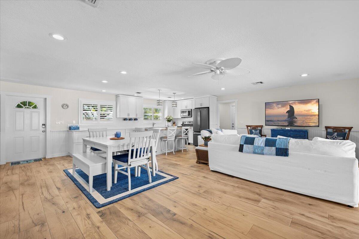 119 Elsa Road Jupiter, FL 33477 - Photo 21 of 38 a living room with furniture and a wooden floor