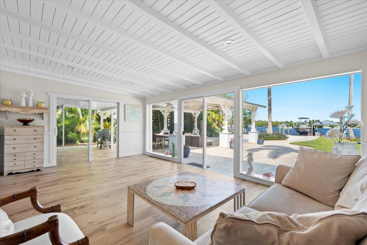 119 Elsa Road Jupiter, FL 33477 - Photo 24 of 38 a living room with furniture and a large window