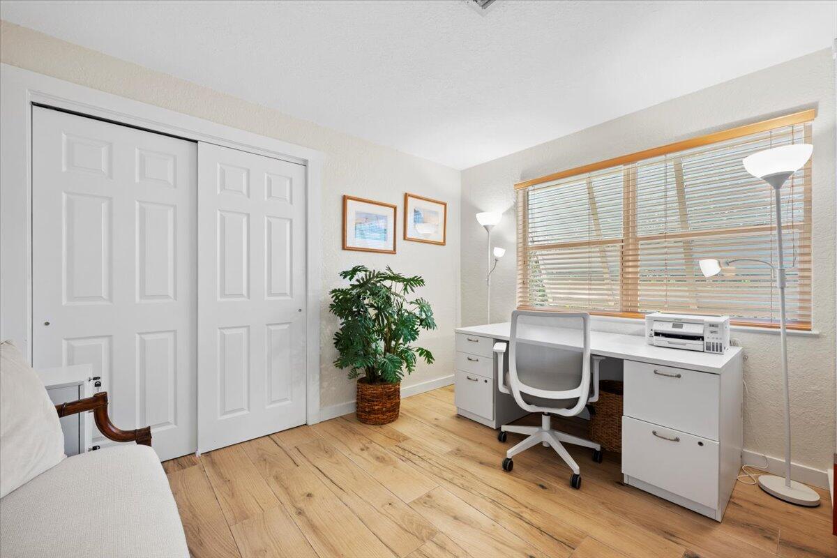 119 Elsa Road Jupiter, FL 33477 - Photo 33 of 38 a view of a workspace with furniture and a window