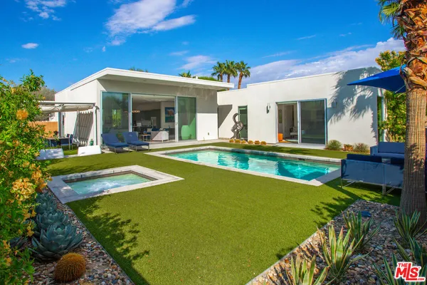 a view of swimming pool with a yard