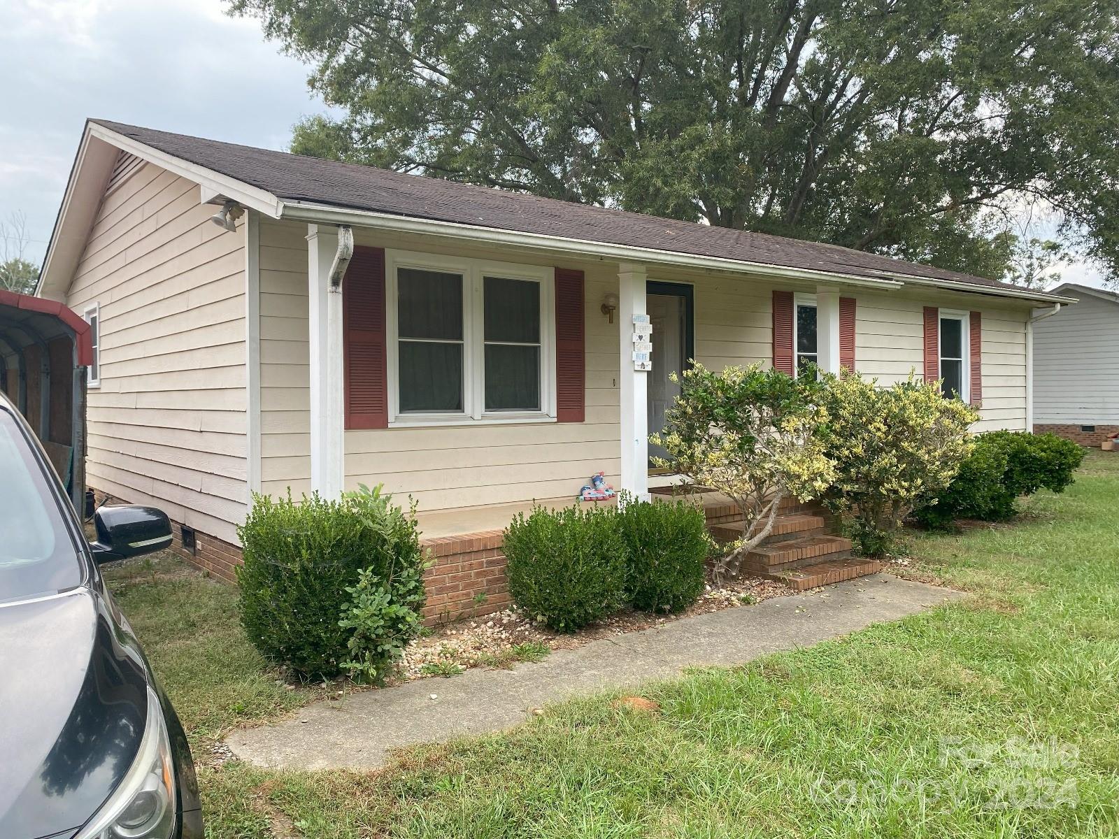 716 Edgehill Drive Monroe, NC 28110 - Photo 1 of 22 a front view of a house with garden