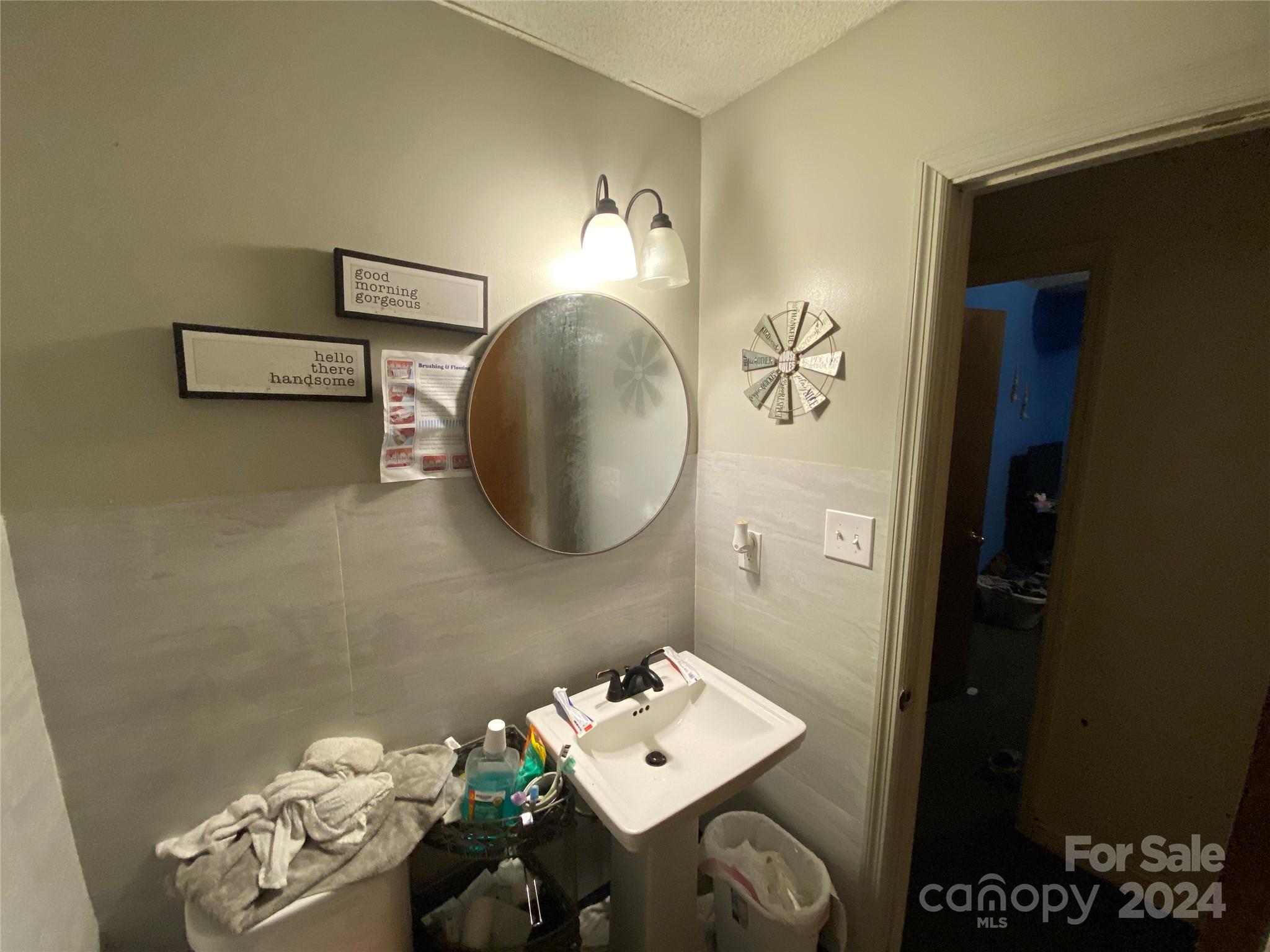 716 Edgehill Drive Monroe, NC 28110 - Photo 14 of 22 a bathroom with a sink mirror and vanity