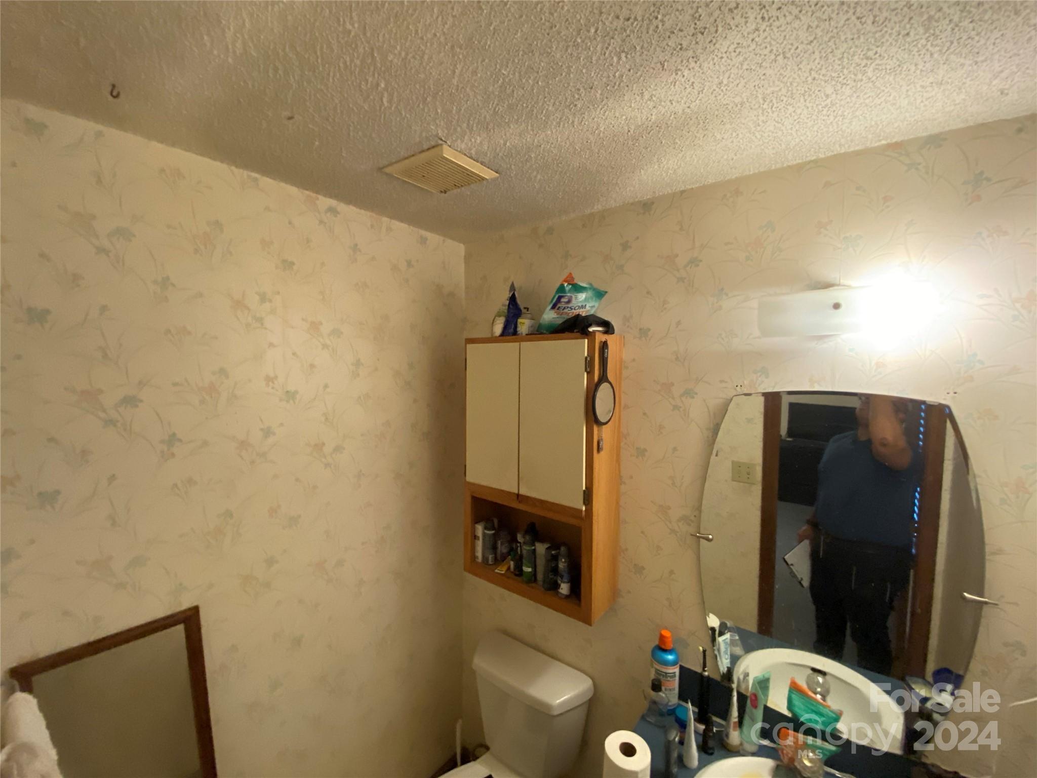 716 Edgehill Drive Monroe, NC 28110 - Photo 15 of 22 a bathroom with a sink and a mirror