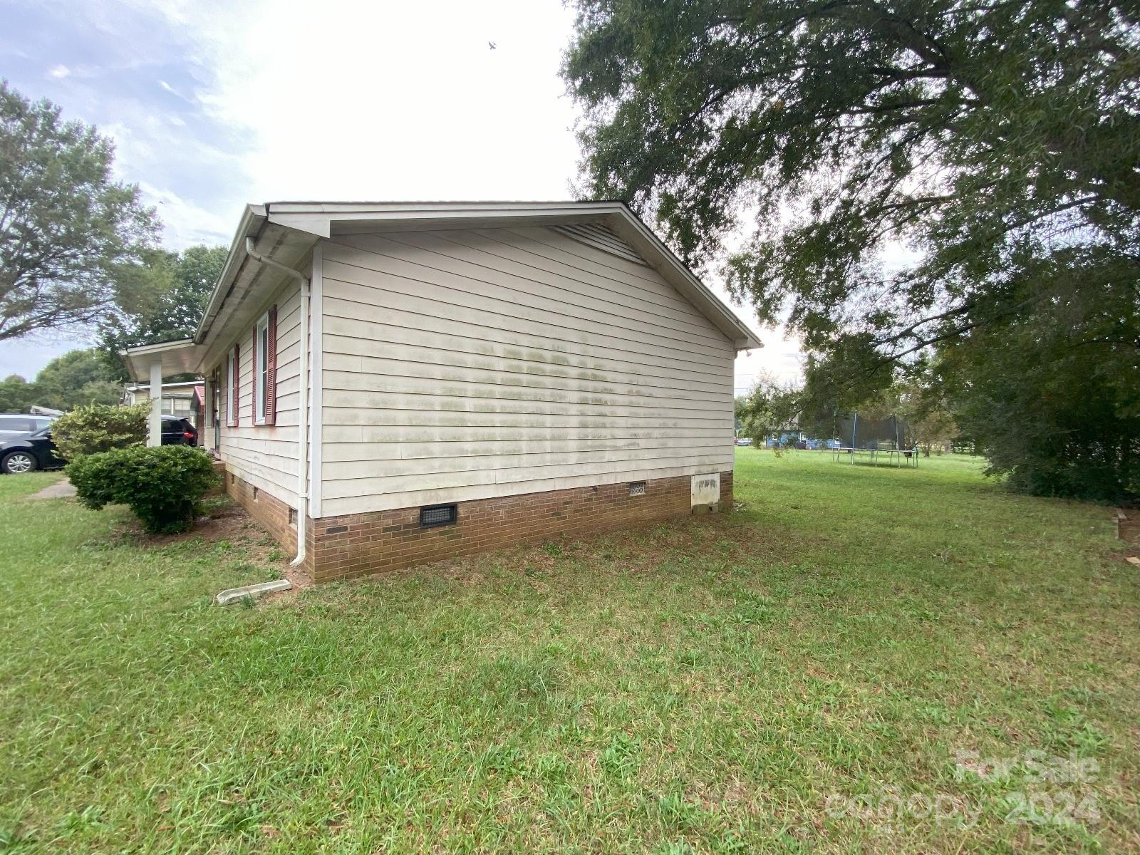 716 Edgehill Drive Monroe, NC 28110 - Photo 2 of 22 a view of a backyard with a garden