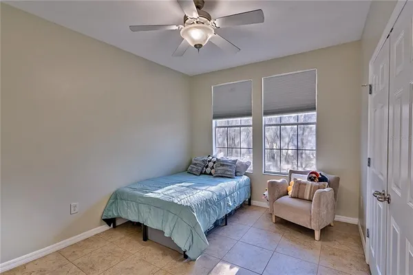 a bedroom with a bed and a couch