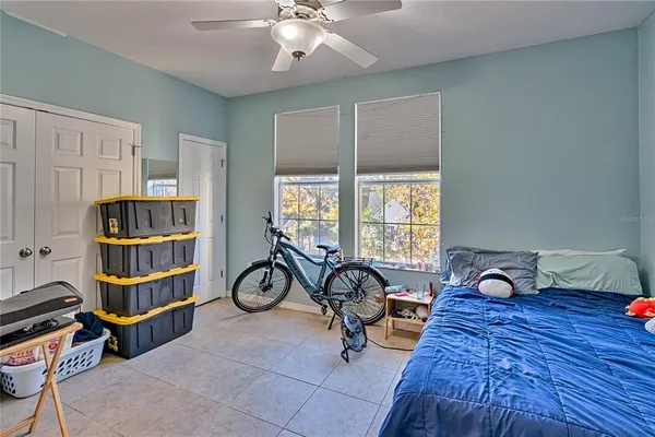 a view of a livingroom with workspace and a window