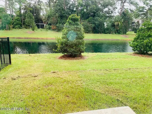 a view of a lake with a yard