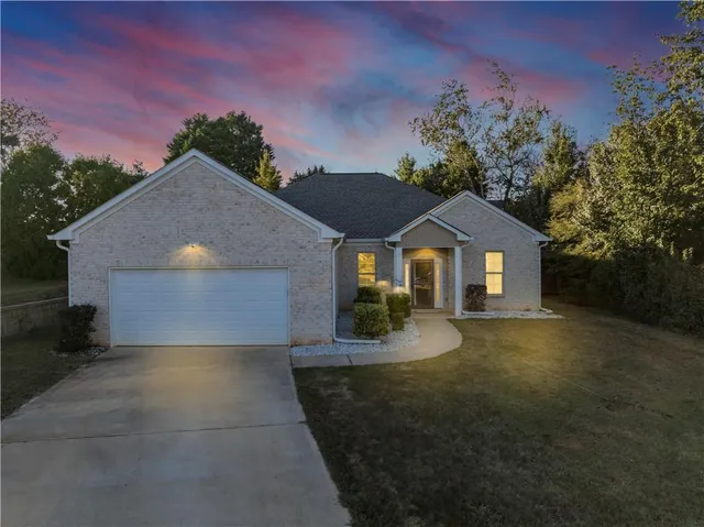 a front view of a house with yard