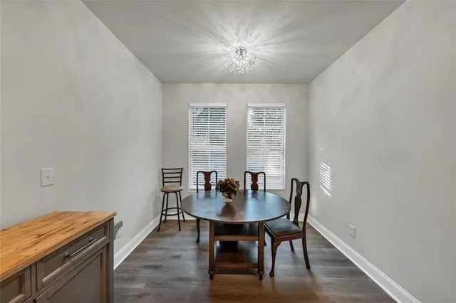 a view of a dining room with furniture and window