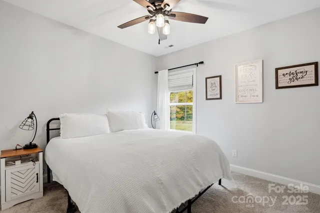 a balcony with furniture and a potted plant