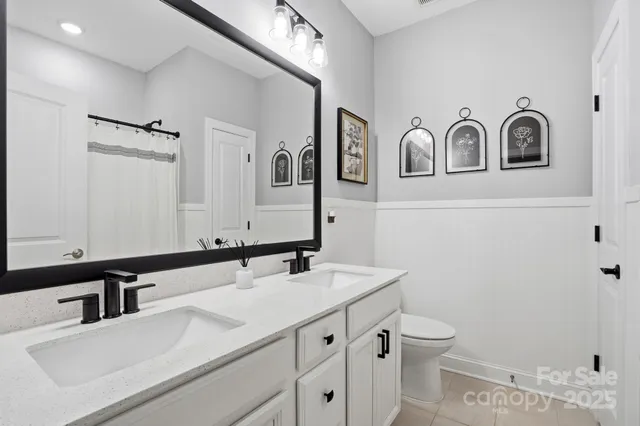 an aerial view of a house with a swimming pool