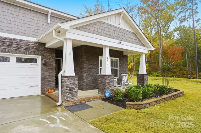 a building outdoor space with patio furniture and glass windows