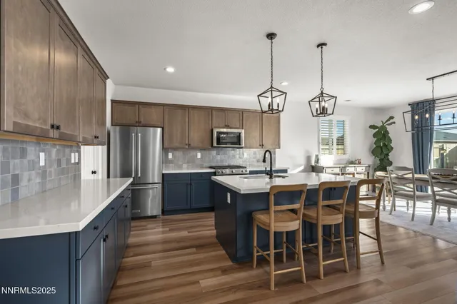 a large kitchen with kitchen island a large island in the center