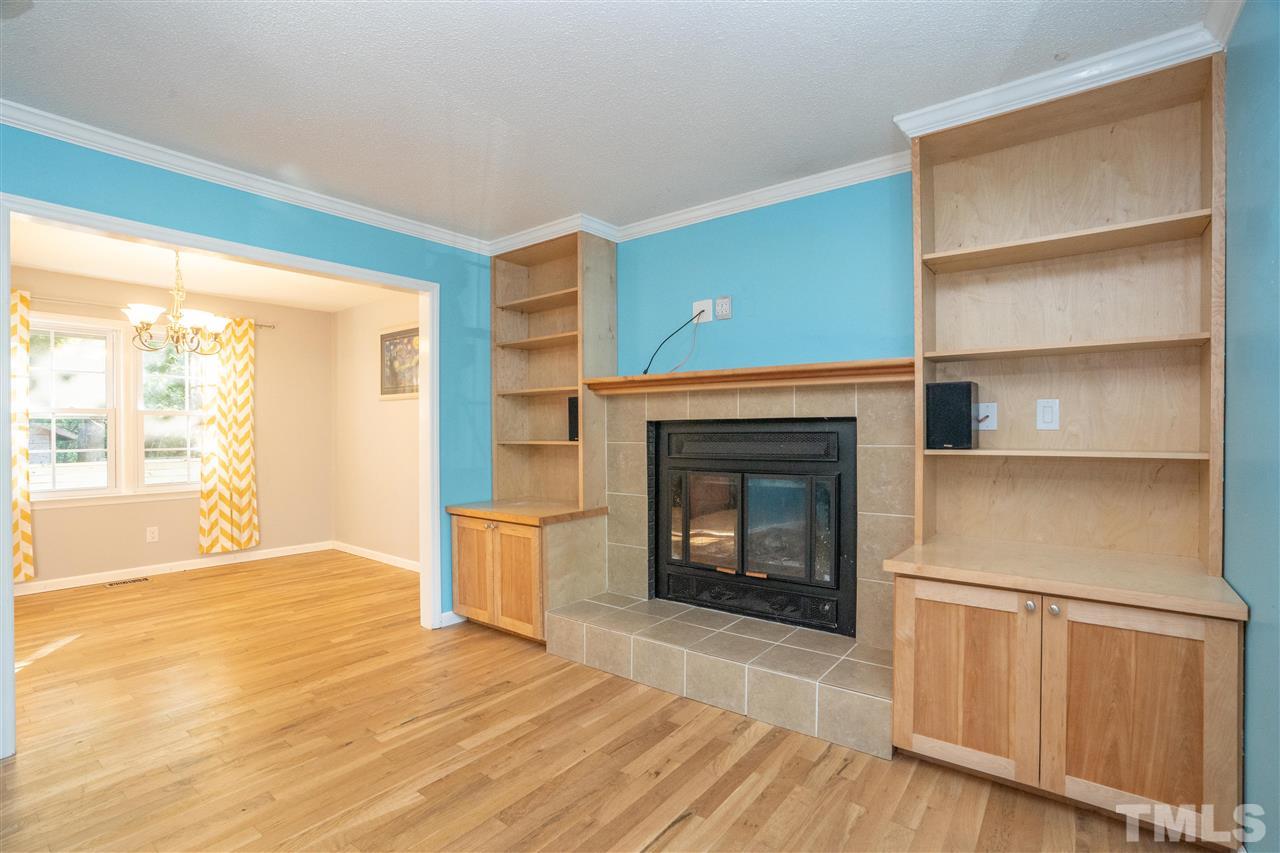 7300 Mine Shaft Road Raleigh, NC 27615 - Photo 2 of 22 a view of an empty room with a fireplace and a window