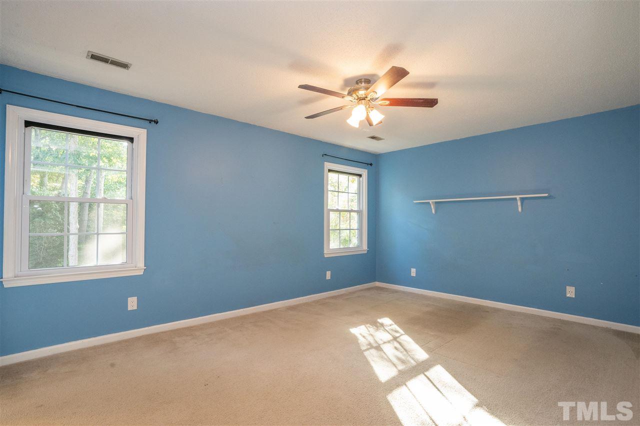 7300 Mine Shaft Road Raleigh, NC 27615 - Photo 13 of 22 a view of a big room with windows and chandelier fan