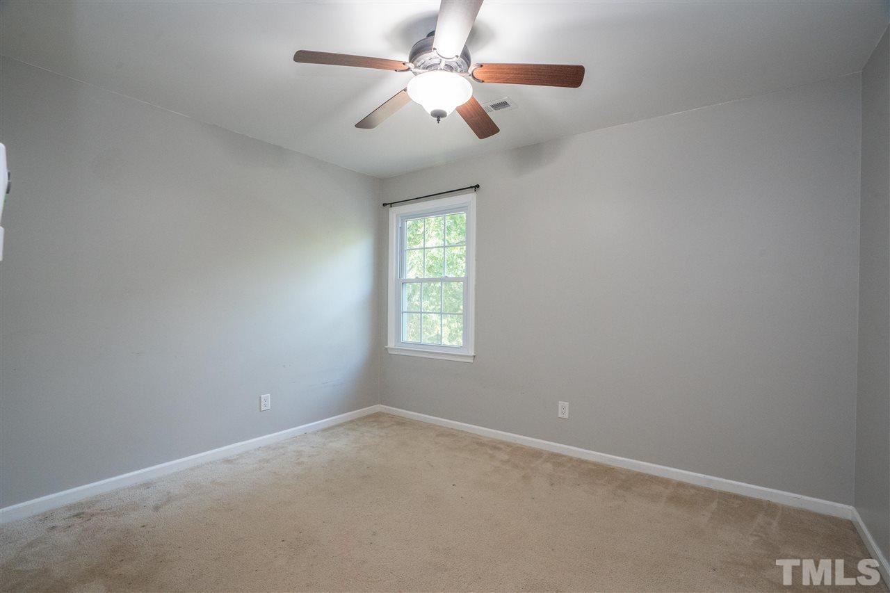 7300 Mine Shaft Road Raleigh, NC 27615 - Photo 18 of 22 an empty room with windows and fan
