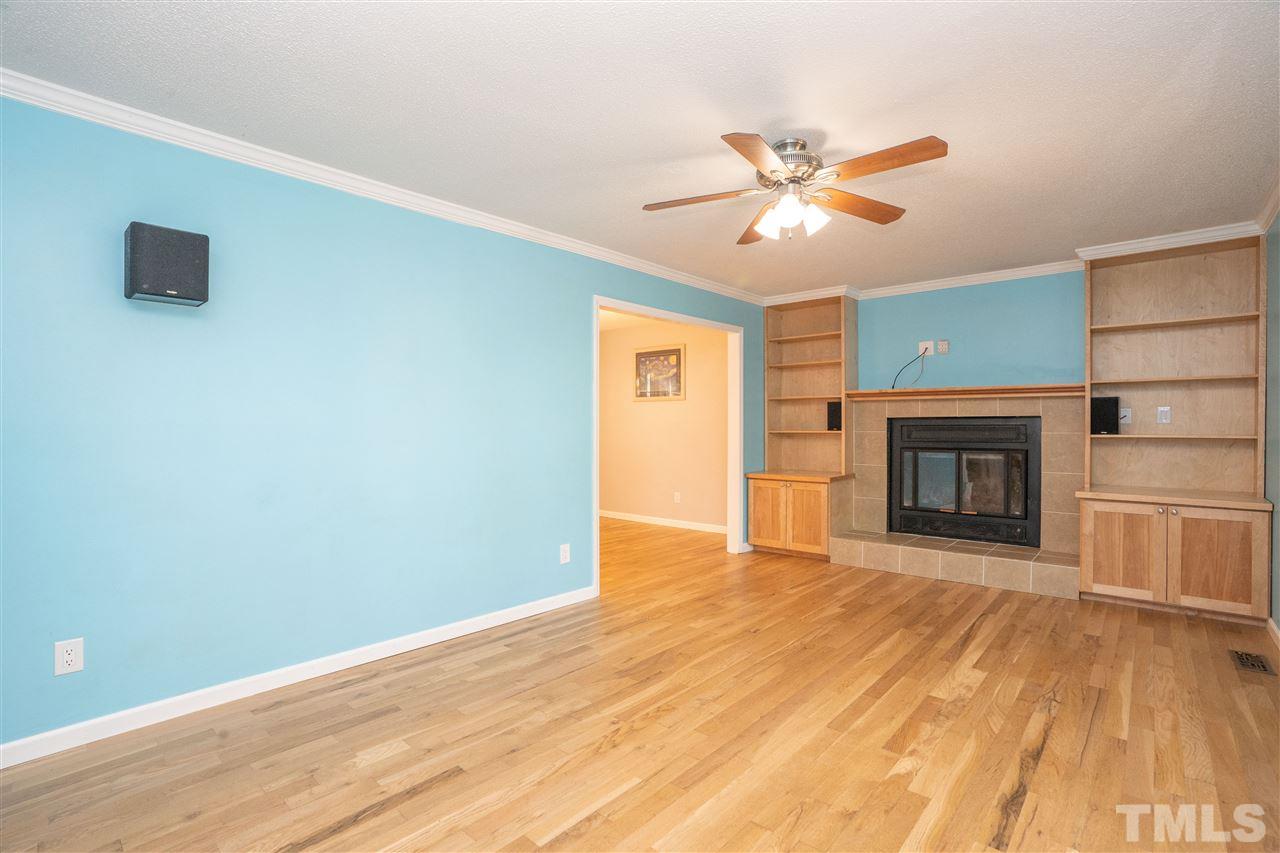 7300 Mine Shaft Road Raleigh, NC 27615 - Photo 3 of 22 a view of empty room with wooden floor and fan