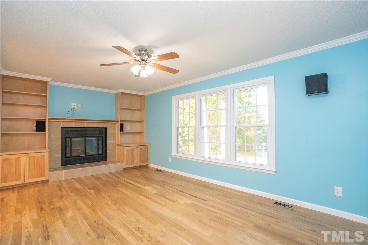 7300 Mine Shaft Road Raleigh, NC 27615 - Photo 4 of 22 a view of an empty room with a window and a fireplace