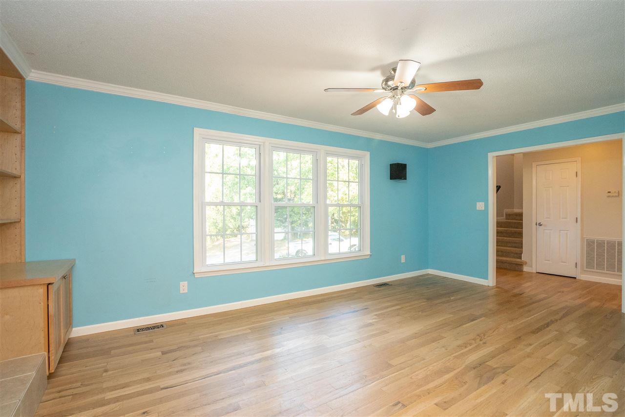 7300 Mine Shaft Road Raleigh, NC 27615 - Photo 6 of 22 a view of an empty room with wooden floor and a window