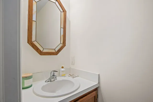 a bathroom with a sink and a mirror