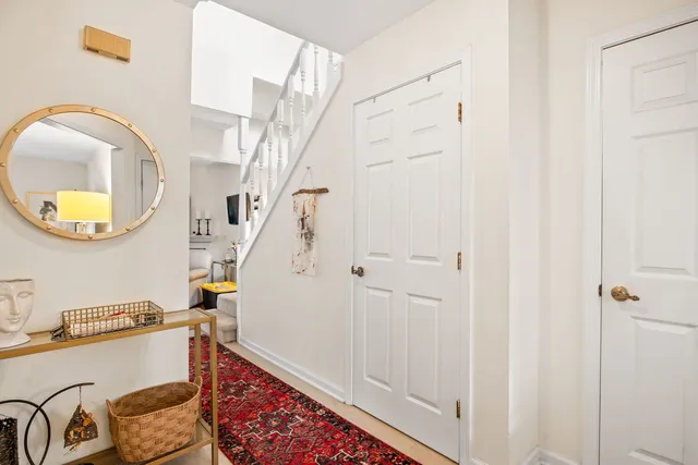 a bathroom with a sink a mirror and a shower curtain