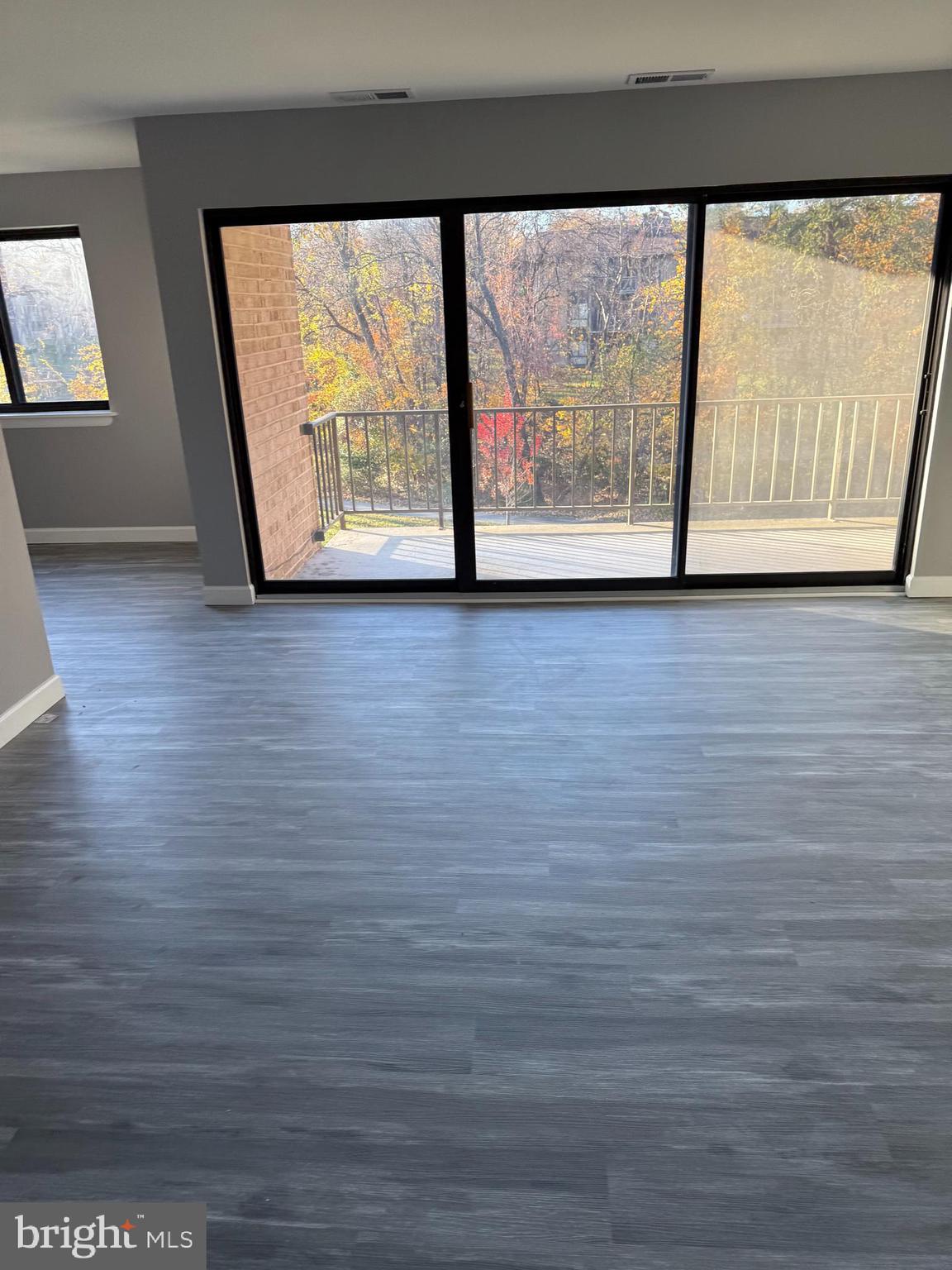 6029 Majors Lane, Unit 4 C16 Columbia, MD 21045 - Photo 11 of 51 a view of outdoor space with wooden floor and window