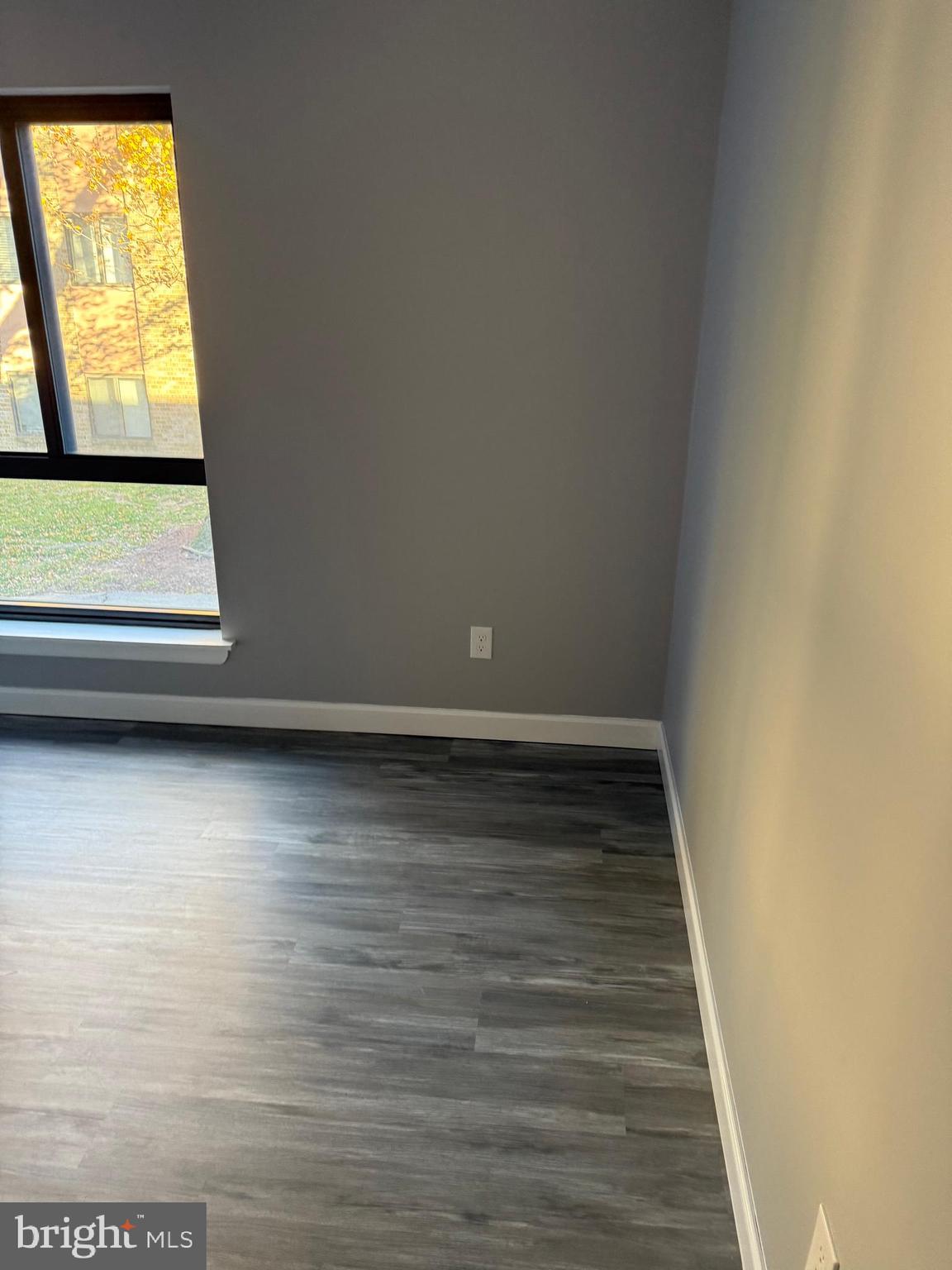 6029 Majors Lane, Unit 4 C16 Columbia, MD 21045 - Photo 20 of 51 a view of room with window and wooden floor