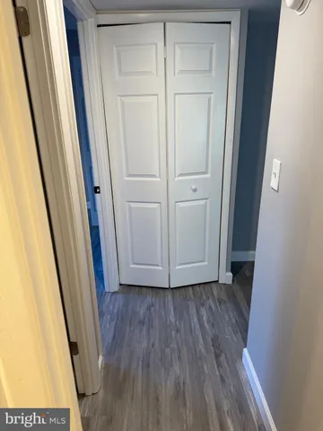 a view of front door with wooden floor