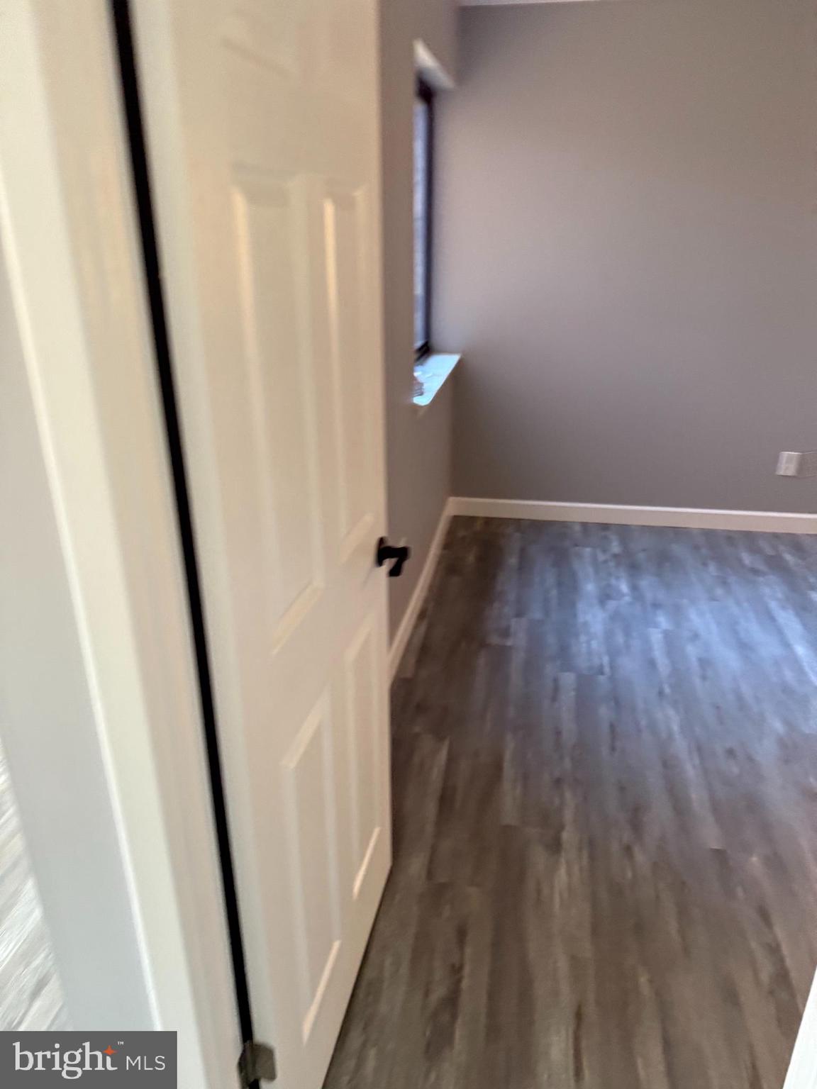 6029 Majors Lane, Unit 4 C16 Columbia, MD 21045 - Photo 7 of 51 a view of a hallway with wooden floor and staircase