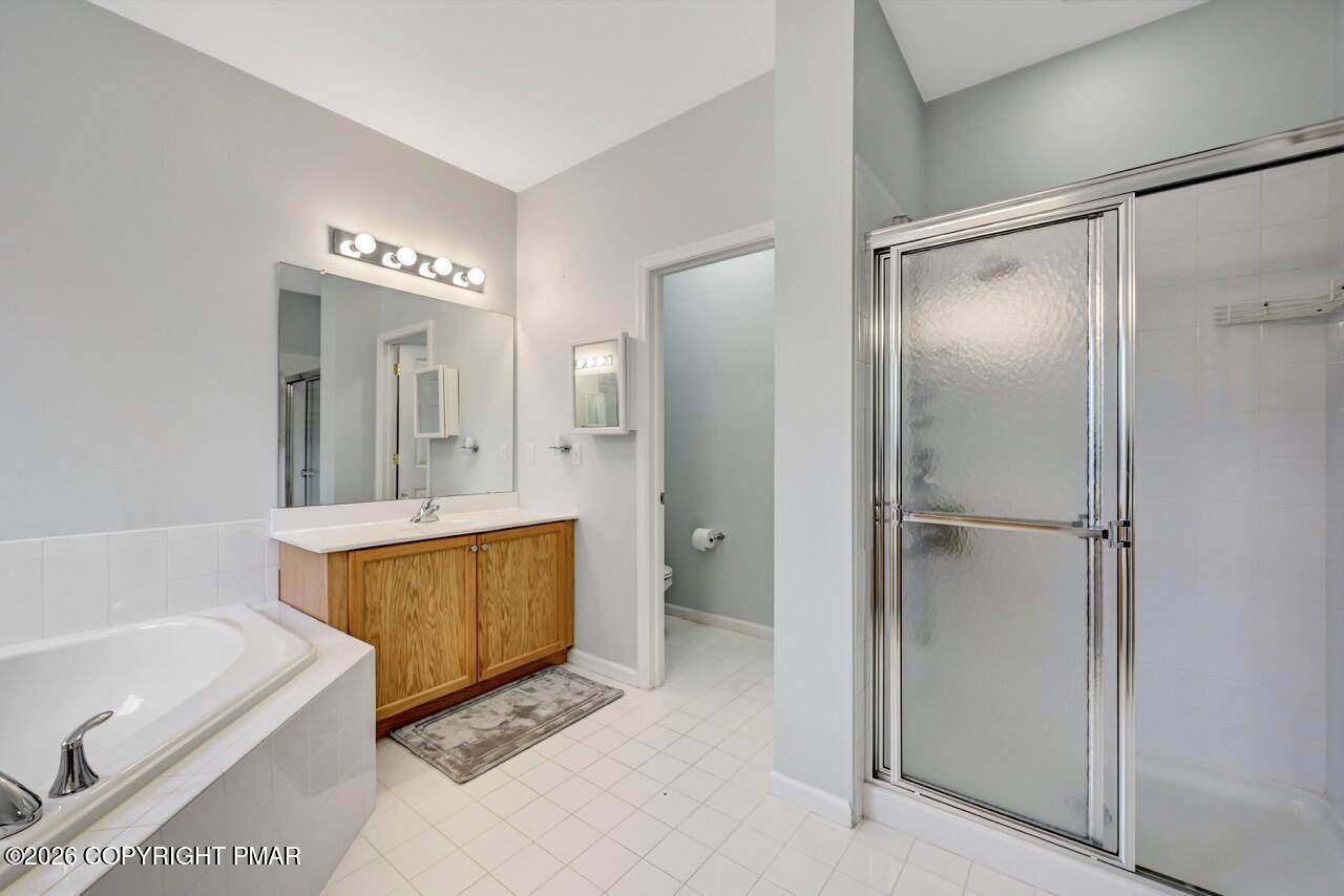 134 Skytop Road Long Pond, PA 18334 - Photo 17 of 48 a bathroom with a tub shower sink and mirror