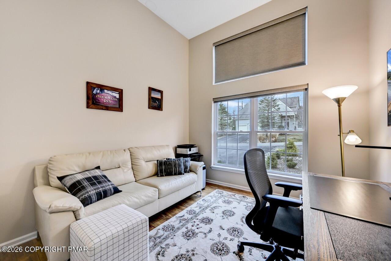 134 Skytop Road Long Pond, PA 18334 - Photo 18 of 48 a living room with furniture and a floor to ceiling window