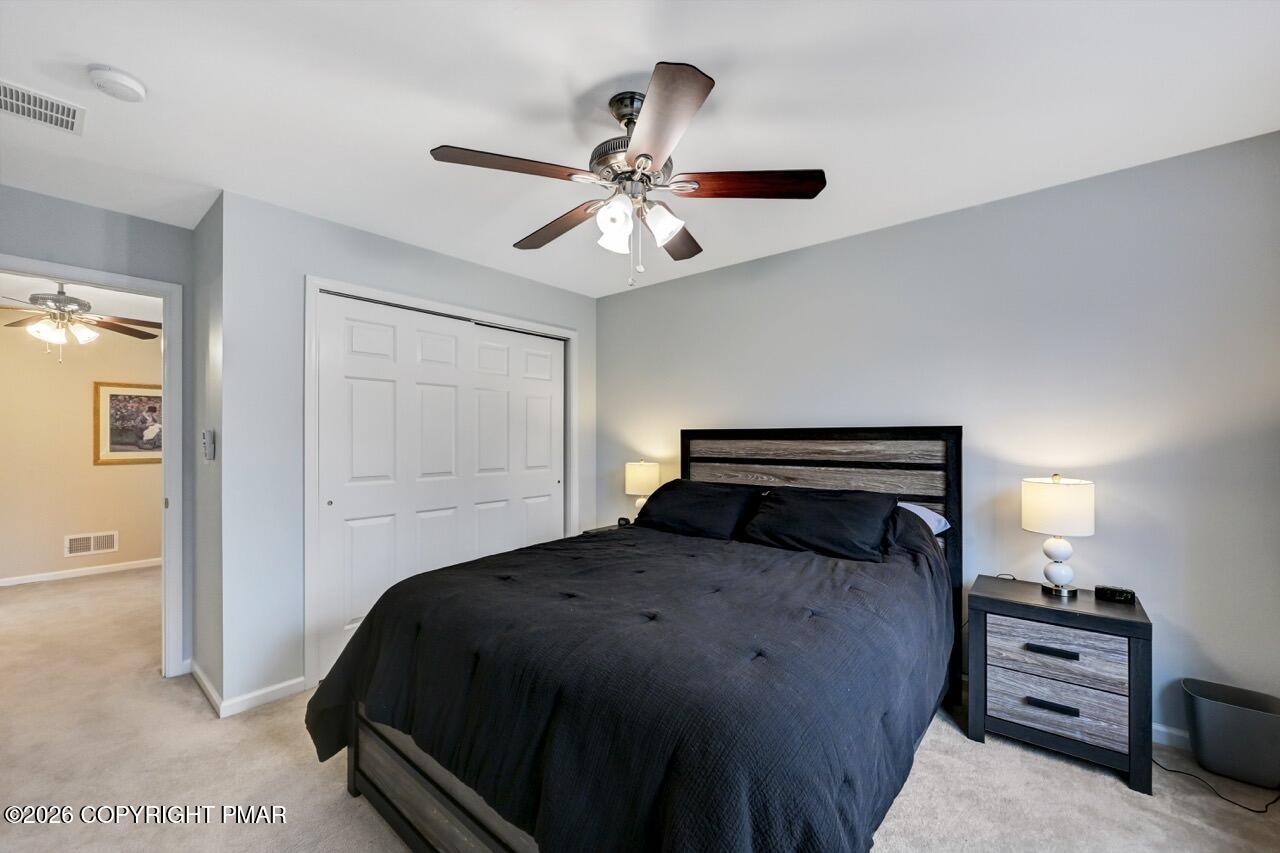 134 Skytop Road Long Pond, PA 18334 - Photo 22 of 48 a bedroom with a bed and cabinet