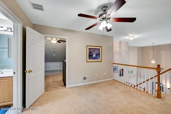a bathroom with a sink a light fixture and a mirror