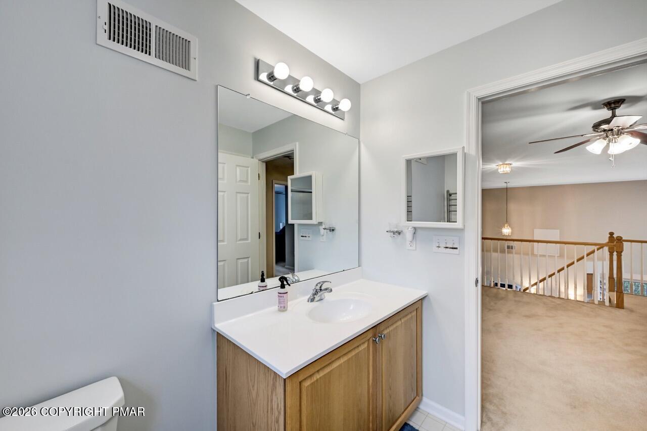 134 Skytop Road Long Pond, PA 18334 - Photo 27 of 48 a bathroom with a sink a light fixture and a mirror
