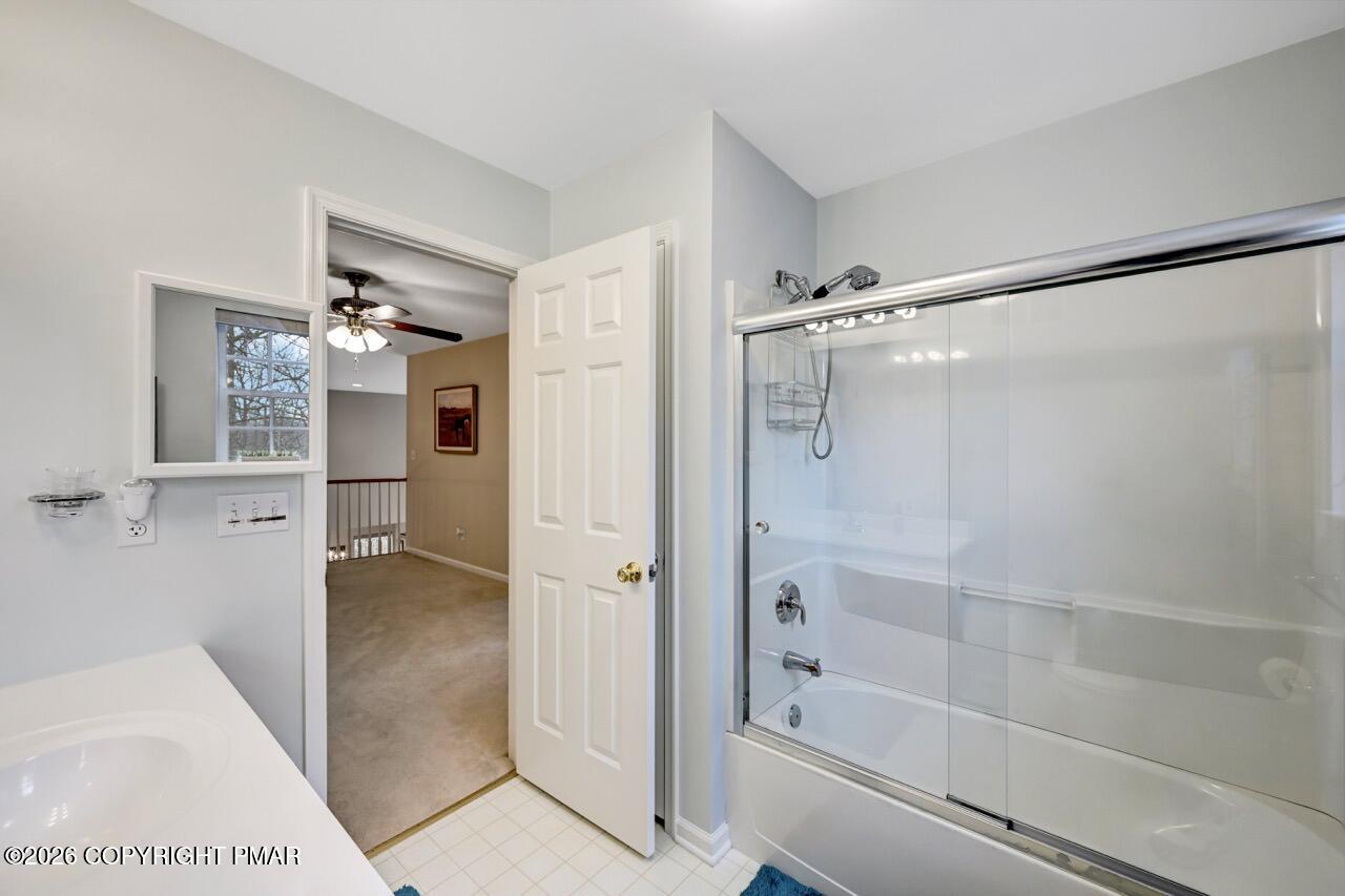134 Skytop Road Long Pond, PA 18334 - Photo 28 of 48 a bathroom with a glass shower door