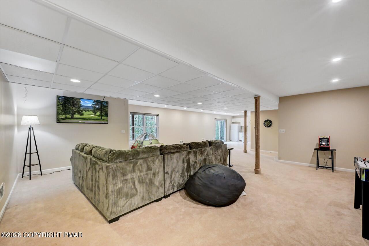 134 Skytop Road Long Pond, PA 18334 - Photo 31 of 48 a living room with furniture and a flat screen tv